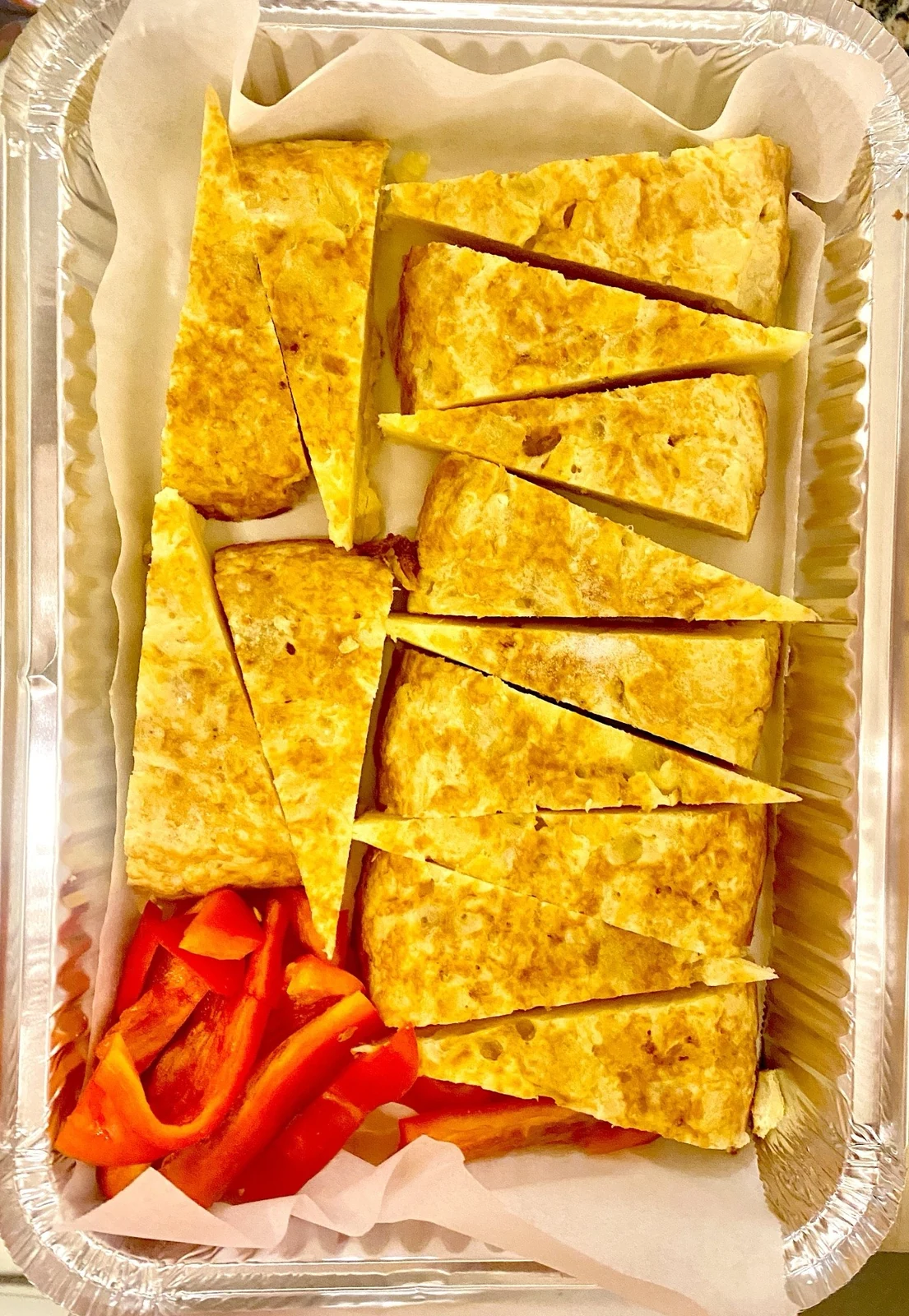 Foto real · Tortilla de patata en porciones
